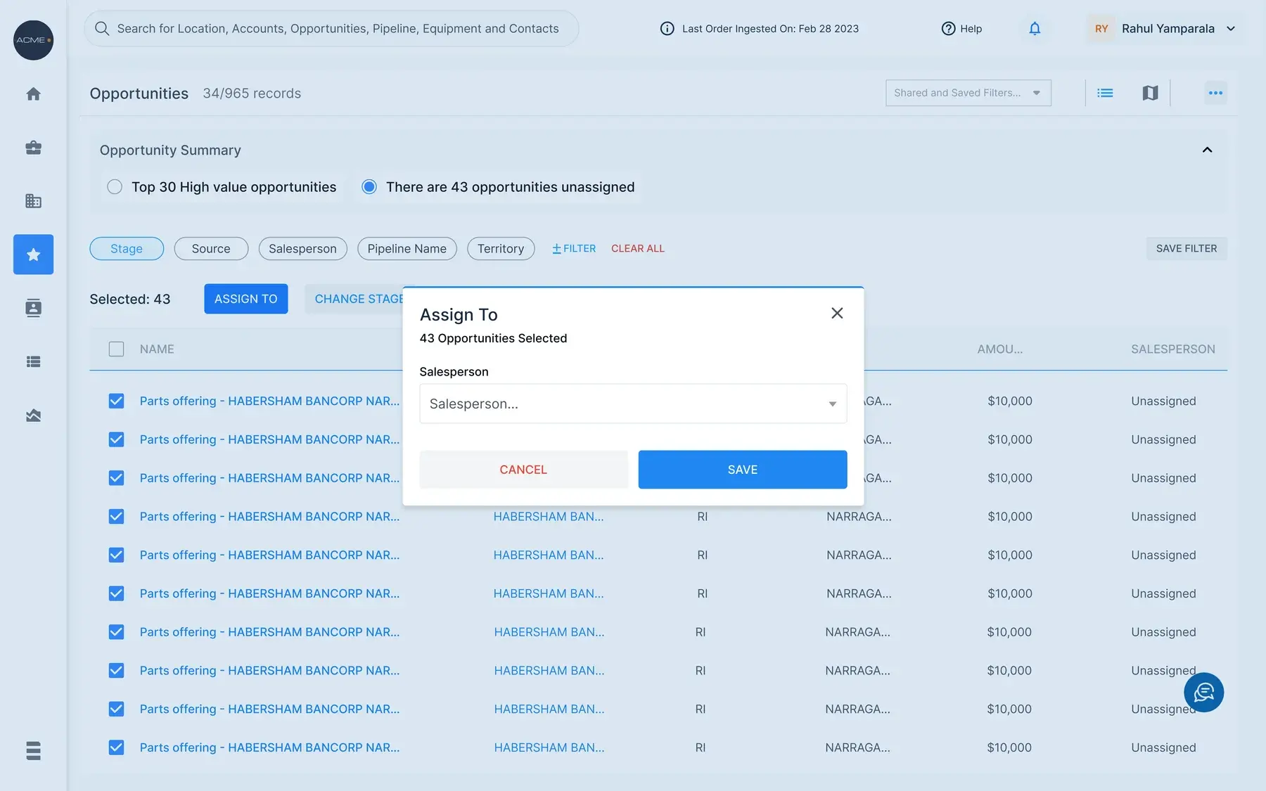 The same Opportunities list switched to the 43 unassigned summary, all 43 rows checked, with an Assign To modal open on a salesperson picker