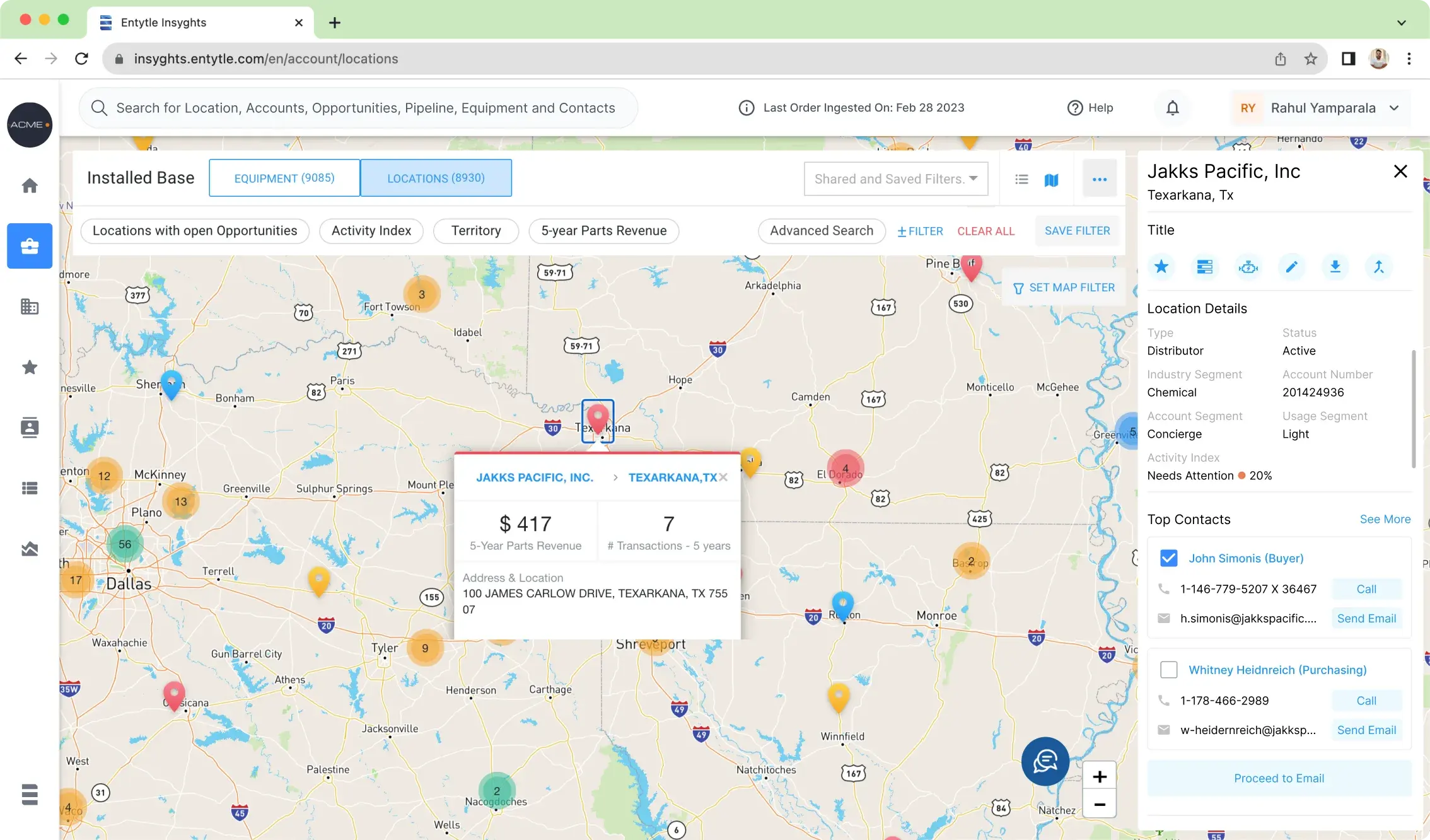 A location selected on the Installed Base map, with a side panel giving its type, segment and an activity index reading needs attention at 20 percent, then its top contacts each with a call and a send email action and a checkbox, above a proceed to email button