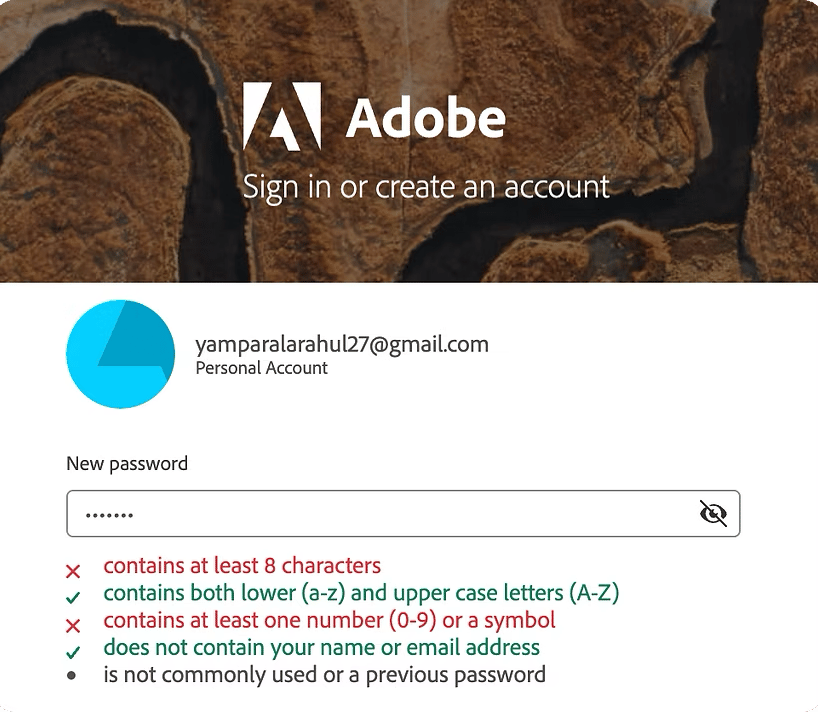 Adobe Creative Cloud new-password field showing a crossed-out eye while the password is masked